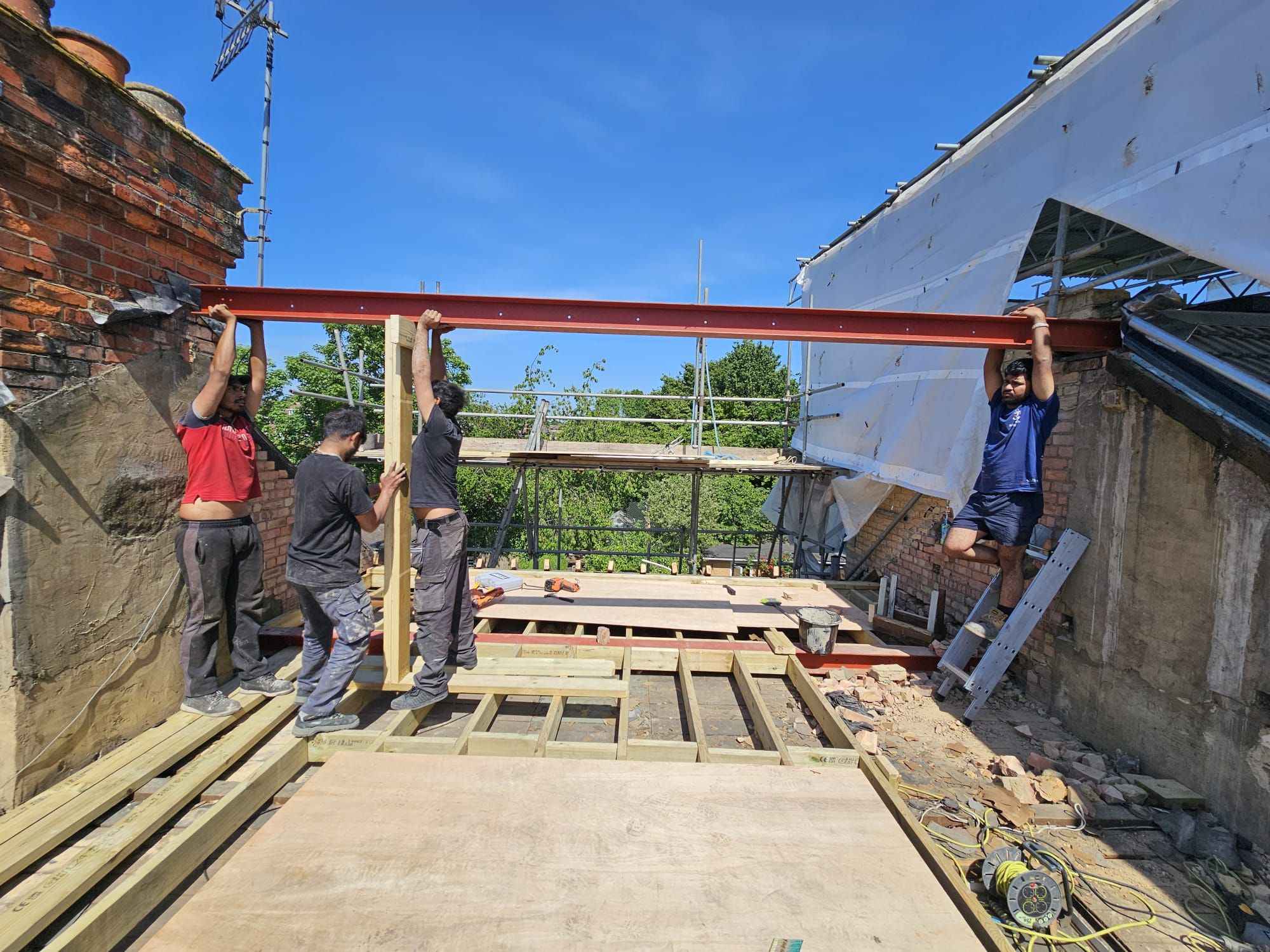 JFA Construction Group site team installing a structural steel beam