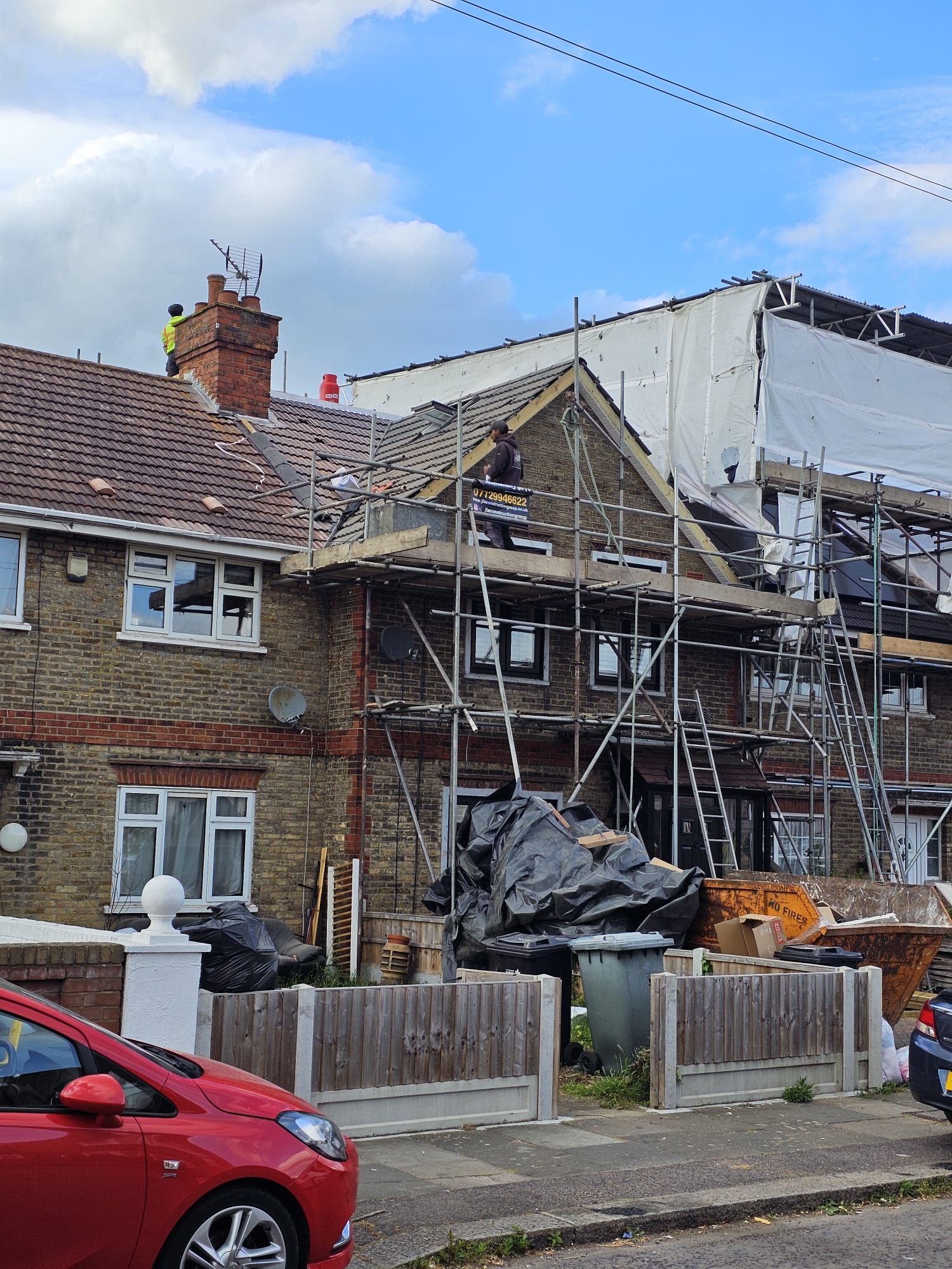 House extension under construction with scaffolding by JFA Construction Group