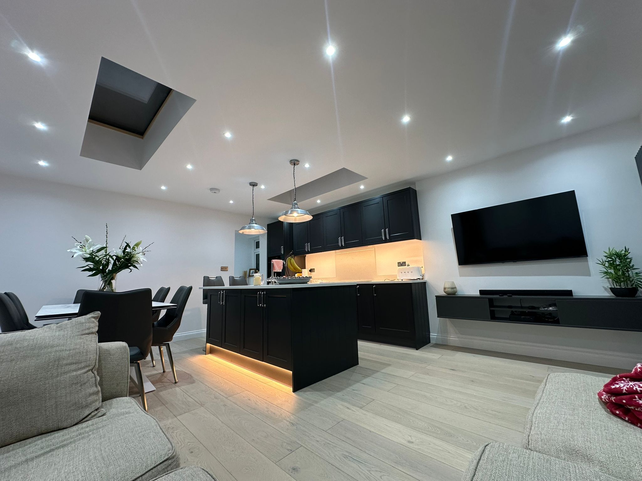 Open-plan living and kitchen space after a whole-house renovation by JFA Construction Group in Wanstead